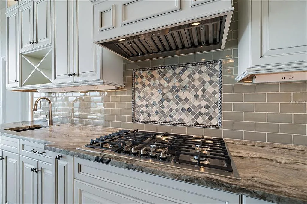 Kitchen tile backsplash with arabesque mosaic accent and gray subway tile in St. Pete Beach, FL