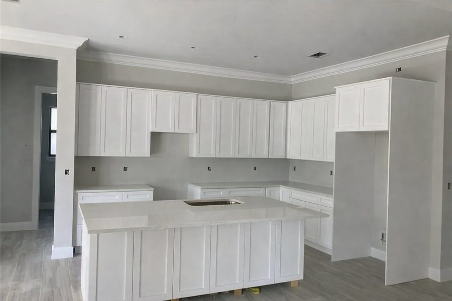 Custom white kitchen cabinet installation