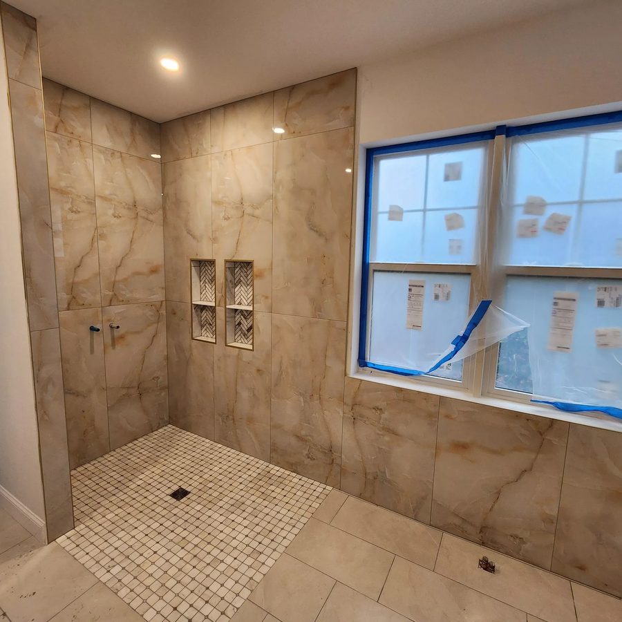 Finished marble-look porcelain shower tile installation in St. Petersburg, FL