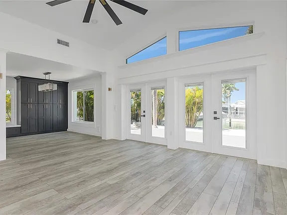 Bright Florida home interior with vaulted ceiling and natural light