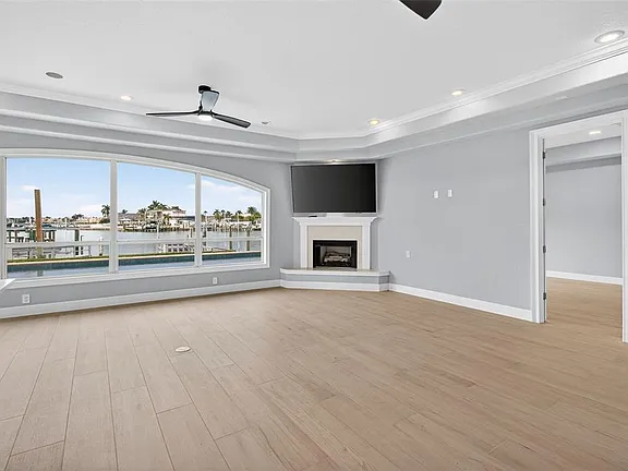 Wood-look porcelain tile flooring in an open living room with water view in St. Petersburg, FL